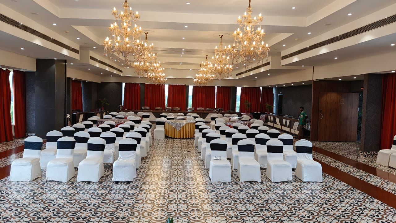 Grand chandelier banquet hall set in theatre style for a conference